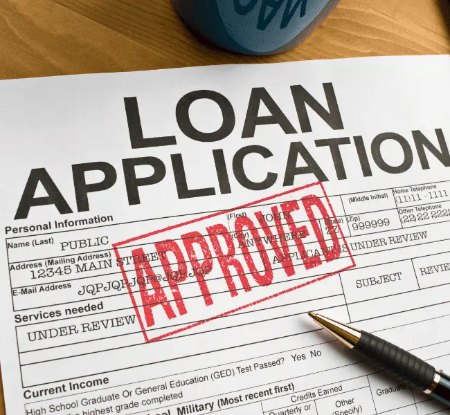 Education loan application with red approved stamp for international studies