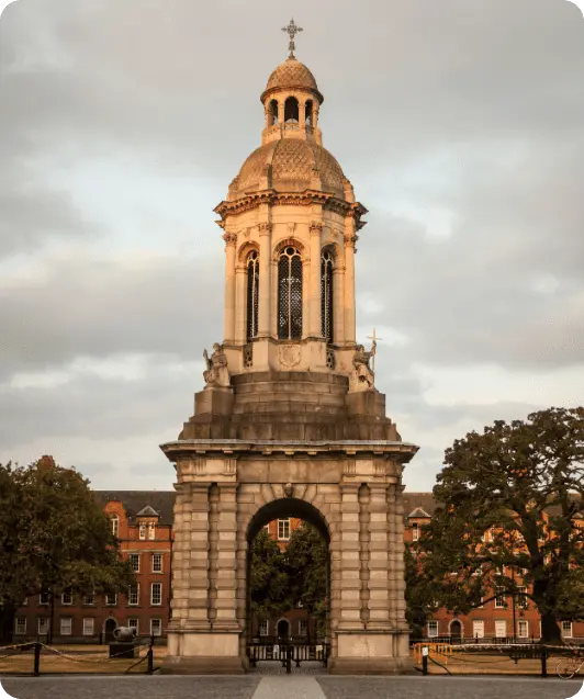 Two students with books inside a large historical library, representing study options in Ireland
